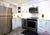 Small All-White Kitchen - Altima Homes Inc.