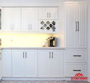 Small All-White Kitchen - Altima Homes Inc.