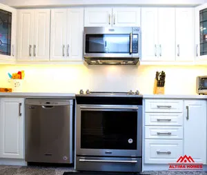 Small All-White Kitchen - Altima Homes Inc.