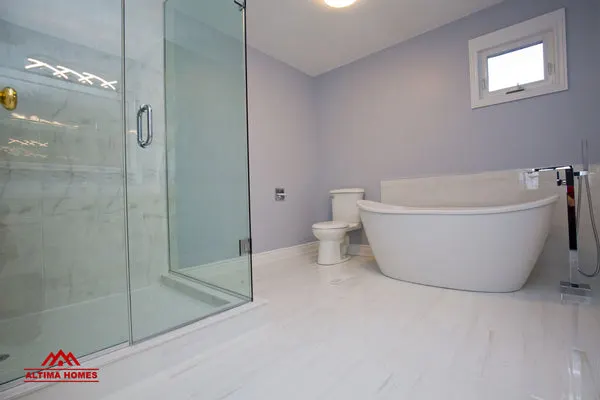 Large Master Bathroom with Vintage Style Tub - Altima Homes Inc.