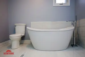 Large Master Bathroom with Vintage Style Tub - Altima Homes Inc.