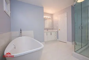 Large Master Bathroom with Vintage Style Tub - Altima Homes Inc.