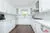 All-White Marble Blacksplash Kitchen - Altima Homes Inc.