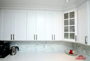All-White Marble Blacksplash Kitchen - Altima Homes Inc.
