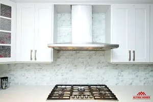 All-White Marble Blacksplash Kitchen - Altima Homes Inc.
