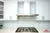All-White Marble Blacksplash Kitchen - Altima Homes Inc.