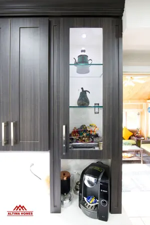 Classic Kitchen With Brown Cabinets - Altima Homes Inc.
