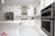 All-White Marble Floor Quartz Countertop Kitchen - Altima Homes Inc.