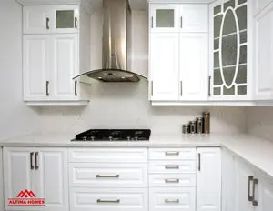 All-White Marble Floor Quartz Countertop Kitchen - Altima Homes Inc.