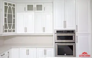 All-White Marble Floor Quartz Countertop Kitchen - Altima Homes Inc.