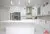 All-White Marble Floor Quartz Countertop Kitchen - Altima Homes Inc.