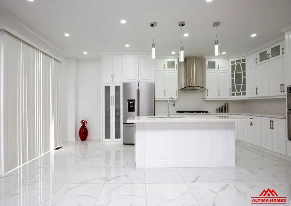 All-White Marble Floor Quartz Countertop Kitchen - Altima Homes Inc.