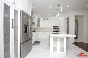 All-White Marble Floor Quartz Countertop Kitchen - Altima Homes Inc.